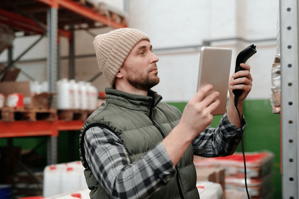 warehouse worker with tablet and scanner